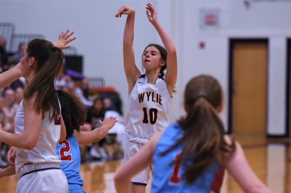 Wylie's Caroline Steadman (10) follows through on a shot during Friday's District 4-5A opener against Lubbock Monterey at Bulldog Gym. Steadman led the Lady Bulldogs with 21 points in the 58-40 loss.