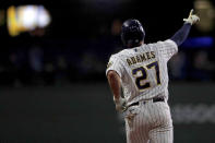 Milwaukee Brewers' Willy Adames gestures as he runs the bases after hitting a two-run home run during the third inning of a baseball game against the New York Mets, Friday, Sept. 24, 2021, in Milwaukee. (AP Photo/Aaron Gash)