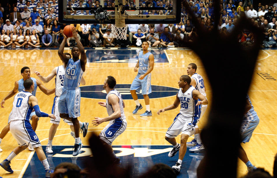 DURHAM, NC - MARCH 03: Harrison Barnes #40 of the North Carolina Tar Heels drives to the basket on Miles Plumlee #21 of the Duke Blue Devils during their game at Cameron Indoor Stadium on March 3, 2012 in Durham, North Carolina. (Photo by Streeter Lecka/Getty Images)