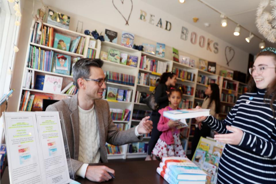 Nyack native Soon Wiley signs a copy of his debut novel "When We Fell Apart" at Booksy Galore in Pound Ridge April 30, 2022. The book is getting over-the-top buzz in the publishing world.