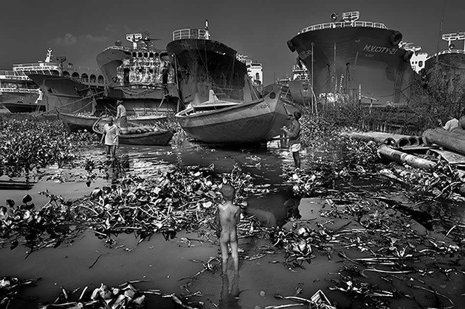 Buriganga River, Dhaka, Bangladesh. Toxic Waters. <br><br>In January 2010, Bangladesh began trying to clean up one of the dirtiest rivers in the world, the Buriganga. It only took one generation to turn what was once a thriving river with drinkable water into a river that is so toxic that no fish can survive in there. <br><br>Camera: Canon 5D Mark II <br><br>Larry Louie, Canada <br><br>Special Mention, Natural Elements