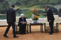 U.S. Treasury Secretary Janet Yellen, center, is seated before a meeting with Chinese Premier Li Qiang, right, at the Great Hall of the People in Beijing, China, Sunday, April 7, 2024. Yellen, who arrived later in Beijing after starting her five-day visit in one of China's major industrial and export hubs, said the talks would create a structure to hear each other's views and try to address American concerns about manufacturing overcapacity in China. (AP Photo/Tatan Syuflana, Pool)