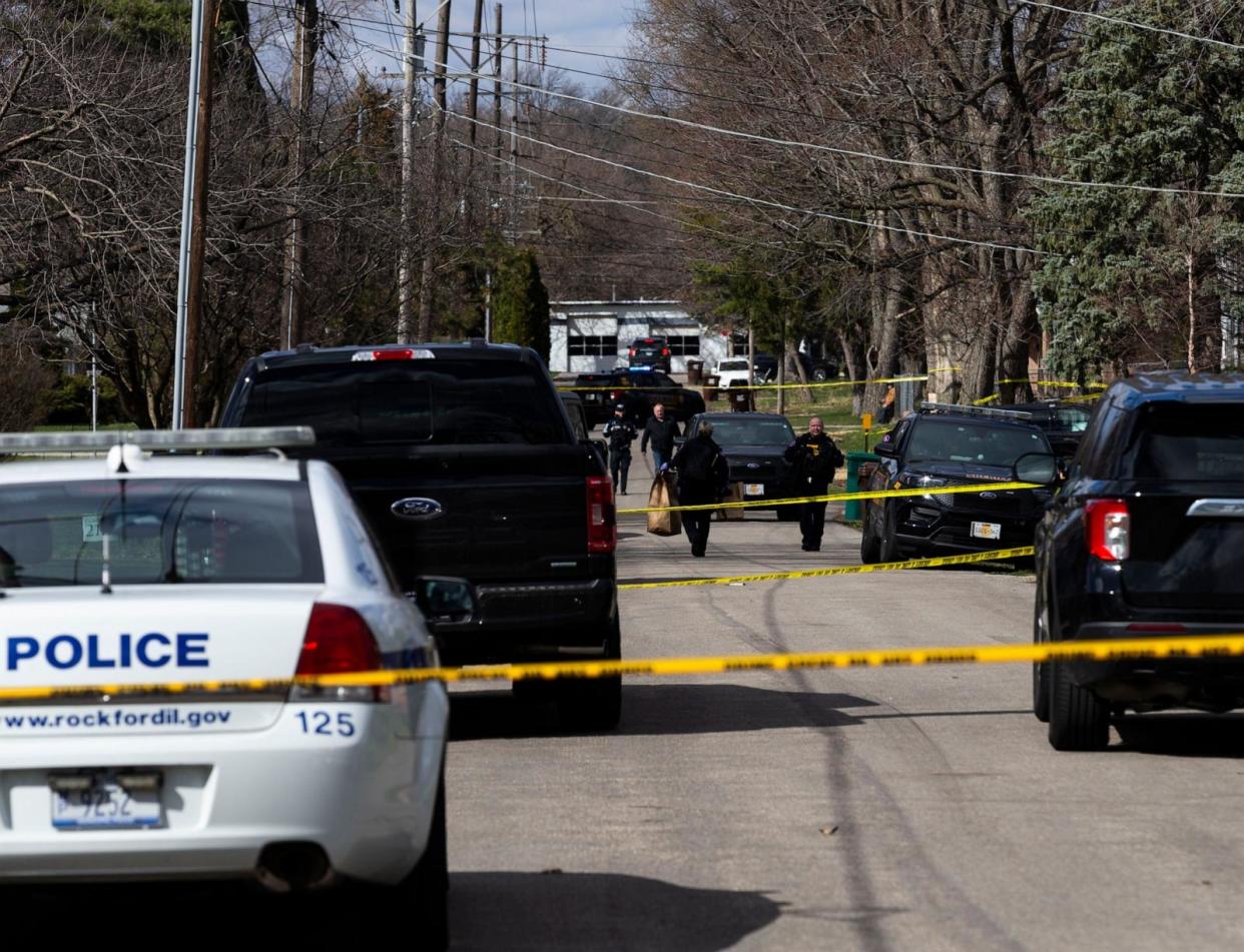 PHOTO: An officer brings out bags of evidence after a stabbing incident on March 27, 2024, near Cleveland Avenue in Rockford, Ill. (Kara Hawley/Rockford Register St via USA Today Network)