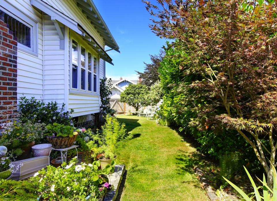 <body><p>Side yards are often ignored, or just relegated to garbage can storage. Used correctly, however, this precious square footage can help you expand your usable space. Incorporate the side yard into your landscaping plan by planting a <a rel="nofollow noopener" href=" http://www.bobvila.com/articles/diy-herb-garden-diy-lite/?bv=yahoo" target="_blank" data-ylk="slk:culinary herb garden;elm:context_link;itc:0;sec:content-canvas" class="link ">culinary herb garden</a>, or add a slim cafe table for a morning coffee retreat. Surely, you can find room for those garbage cans in the garage.</p></body>