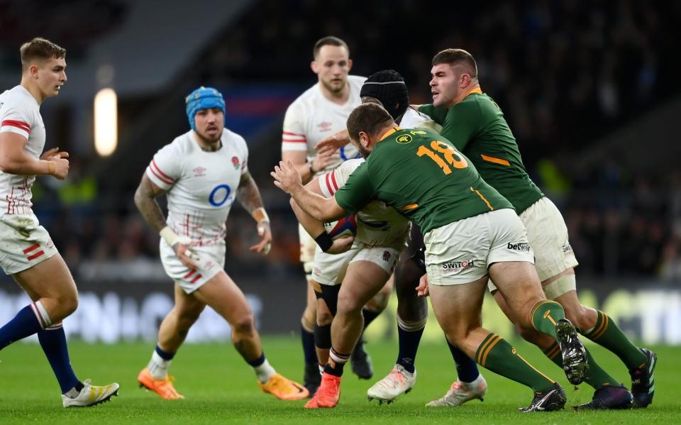 Luke Cowan-Dickie of England is tackled high by Thomas du Toit of South Africa leading to a red card being shown during the Autumn International match between England and South Africa - Alex Davidson/Getty Images