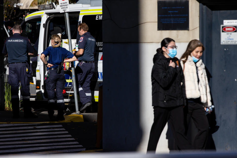 Paramedics are seen at a hospital in Melbourne, where the Covid infections are rising. 