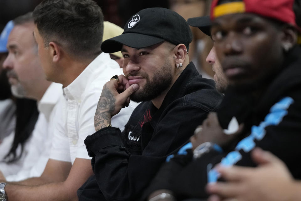 Brazilian soccer player Neymar watches Game 3 of the NBA Finals basketball game between the Miami Heat and the Denver Nuggets, Wednesday, June 7, 2023, in Miami. (AP Photo/Wilfredo Lee)