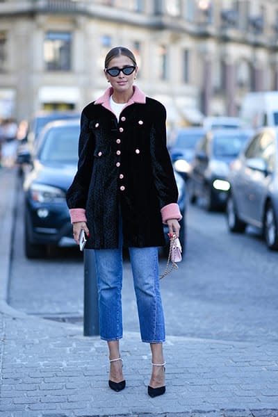 Woman-wearing-button-down-jacket-and-jeans-and-heels