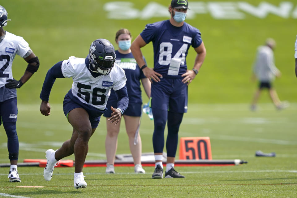 Seattle Seahawks linebacker Jordyn Brooks (56) runs a practice drill during NFL football training camp, Wednesday, Aug. 12, 2020, in Renton, Wash. (AP Photo/Ted S. Warren, Pool)