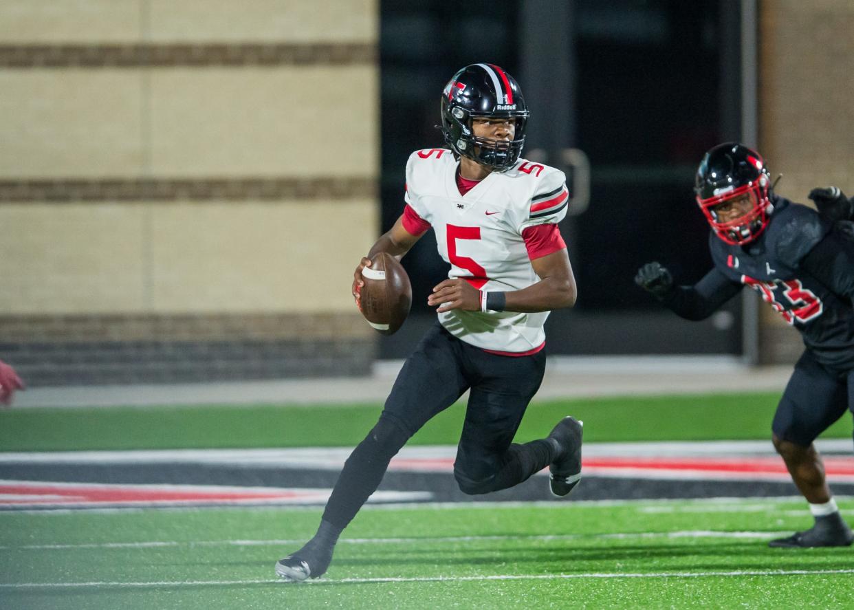 Westmoore's MJ Graham rolls out to pass during the game against Union at Union-Tuttle Stadium in Tulsa, OK on 11/17/23. BRETT ROJO, FOR THE TULSA WORLD
(Credit: BRETT ROJO, FOR THE TULSA WORLD)