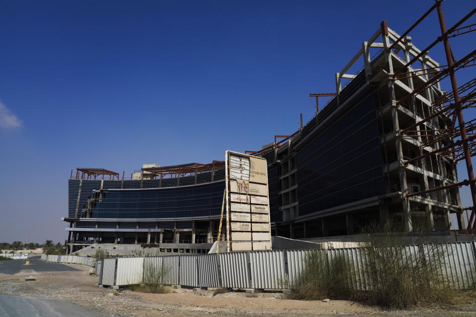 A Union Properties construction project in Dubai Motor City unfinished for years is seen in Dubai, United Arab Emirates, Sunday, Oct. 24, 2021. Emirati prosecutors said Sunday they had launched a major investigation into Dubai-based real estate developer Union Properties, saying they would probe allegations that the long-troubled firm committed fraud and other offenses while trying to claw its way out of debt. (AP Photo/Jon Gambrell)