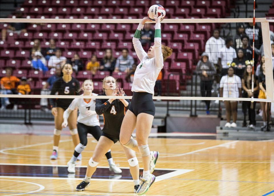 OKC McGuinness' Clare Kierl sets the ball during the 5A State Volleyball Finals against Booker T. Washington at the Union Multipurpose Activity Center in Tulsa, OK on 10/21/23. BRETT ROJO, FOR THE TULSA WORLD
