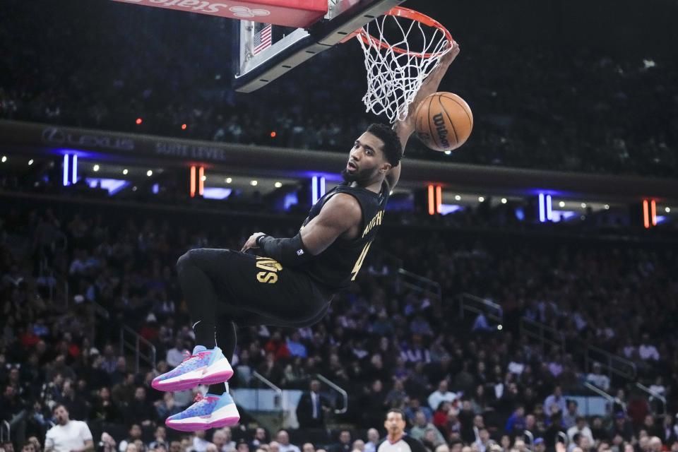 Cleveland Cavaliers' Donovan Mitchell (45) dunks the ball during the first half of an NBA basketball game against the New York Knicks Tuesday, Jan. 24, 2023, in New York. (AP Photo/Frank Franklin II)