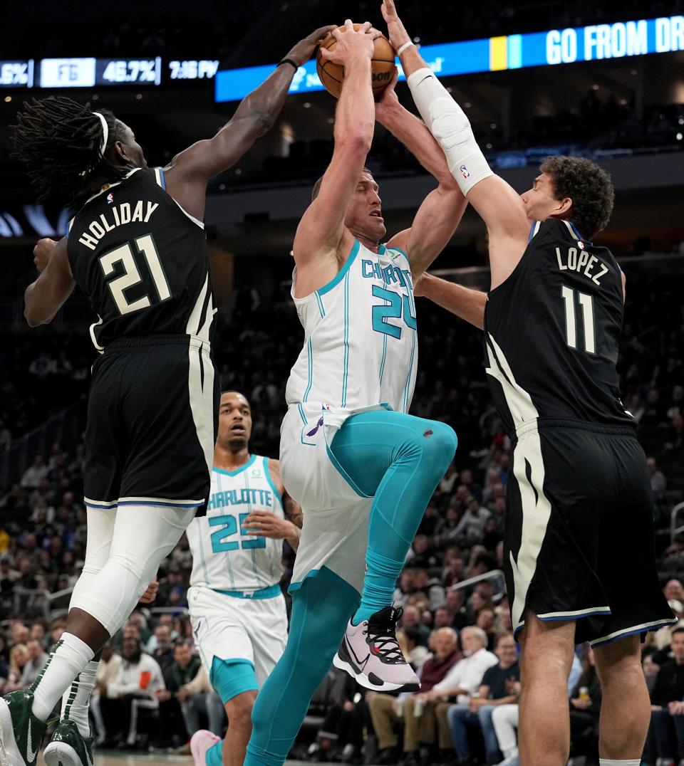 Jrue Holiday and Brook Lopez were named to the NBA all-defensive first team on Tuesday.