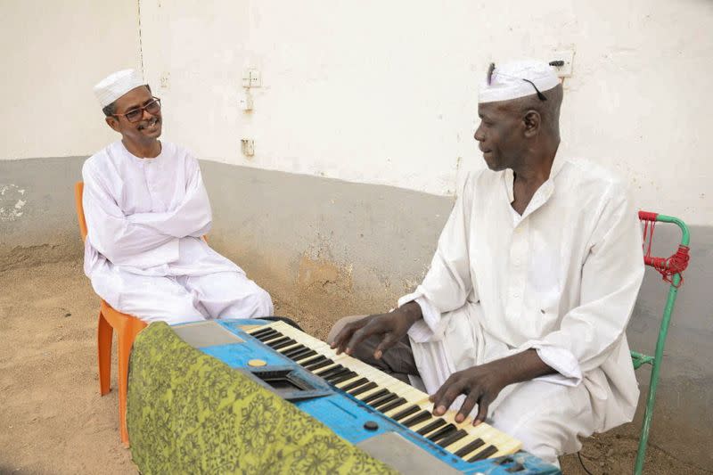 After Sudanese musician wife flees war, Sudanese music professor waits to travel to her in Port Sudan