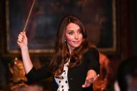<p>Looks like even the royals are fans of <em>Harry Potter</em>! During the Inauguration of Warner Bros. Studios Leavesden, Kate waved a wand on the set of Diagon Alley. Think she was explaining the proper way to pronounce "Wingardium Leviosa"?</p>