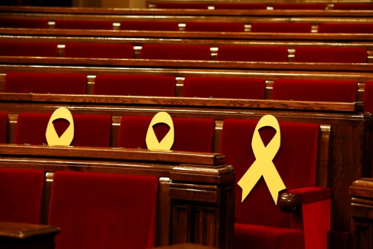 Yellow ribbons in support of jailed Catalan separatist leaders are displayed on seats at the Catalan parliament