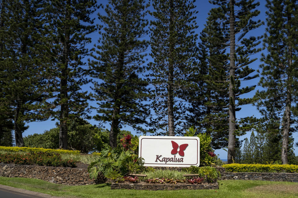 A Kapalua Ridge Villas sign is viewed Tuesday, Oct. 3, 2023, in Lahaina, Hawaii. The resort will re-open Sunday, Oct. 8, 2023, as the first phase for tourism returning to West Maui. (AP Photo/Mengshin Lin)