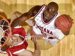 Indiana\'s Marco Killingsworth lays the ball in over Nicholls State\'s Stefan Blaszczynski during the first half of the Hoosiers\' 99-65 victory in the season-opener Friday. Killingsworth scored 28 points and grabbed 13 rebounds in his Hoosier debut. Chris Howell | Herald-Times