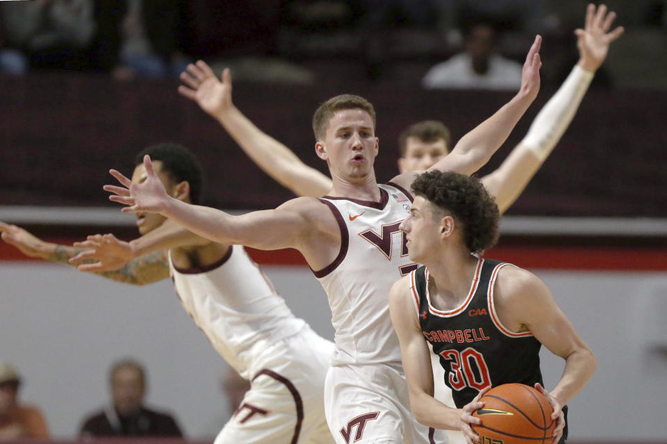 Virginia Tech's Sean Pedulla (3) defends Campbell's Anthony Dell'Orso (30) during the first half of an NCAA college basketball game Wednesday, Nov. 15, 2023, in Blacksburg, Va. (Matt Gentry/The Roanoke Times via AP)