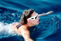 <p>Princess Margaret swims, wearing blocky white sunglasses while on vacation in Costa Smeralda, Sardinia in August 1967.</p>