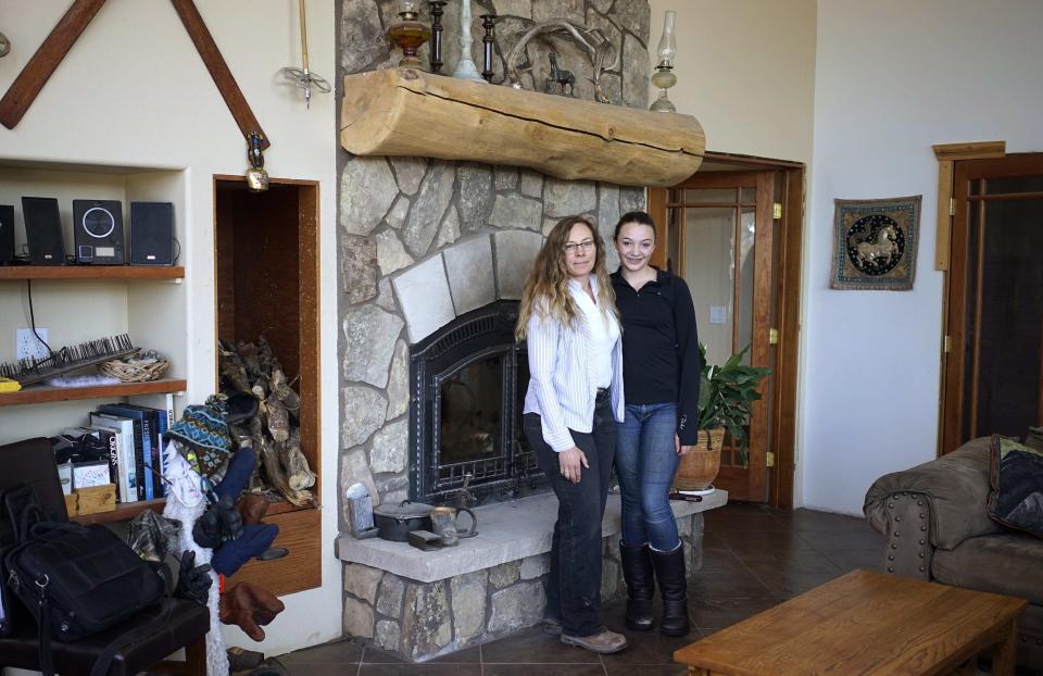 Denise Arthur and her daughter Linnaea Thibedeau pose at their home in the country near Blackhawk
