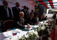 Nadeem Naqvi, Managing Director of the Pakistan Stock Exchange, signs an agreement for a Chinese-led consortium to buy a strategic stake in PSX in Karachi, Pakistan, January 20, 2017. REUTERS/Akhtar Soomro/File Photo