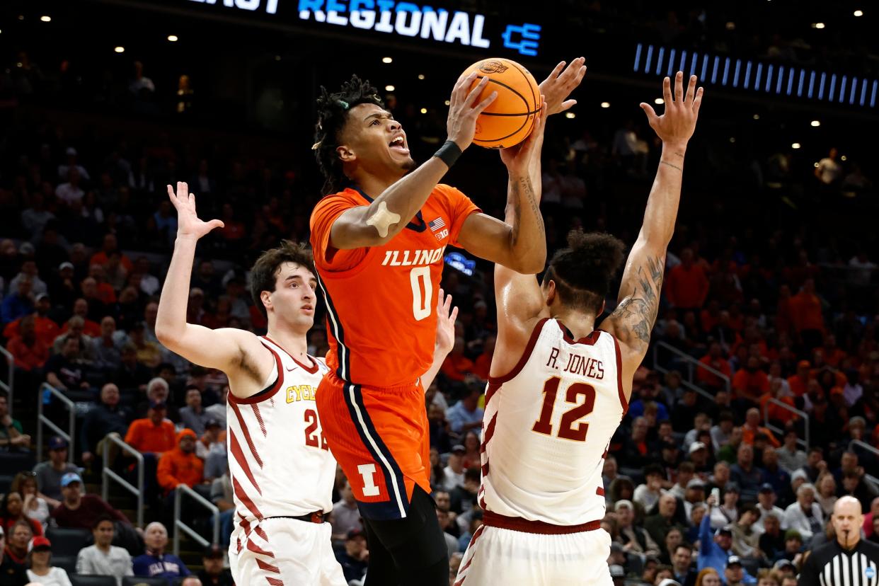 Illinois guard Terrence Shannon Jr. (0) shoots the ball over Iowa State forward Robert Jones during the semifinals of the East Regional of the 2024 NCAA men's tournament at TD Garden.