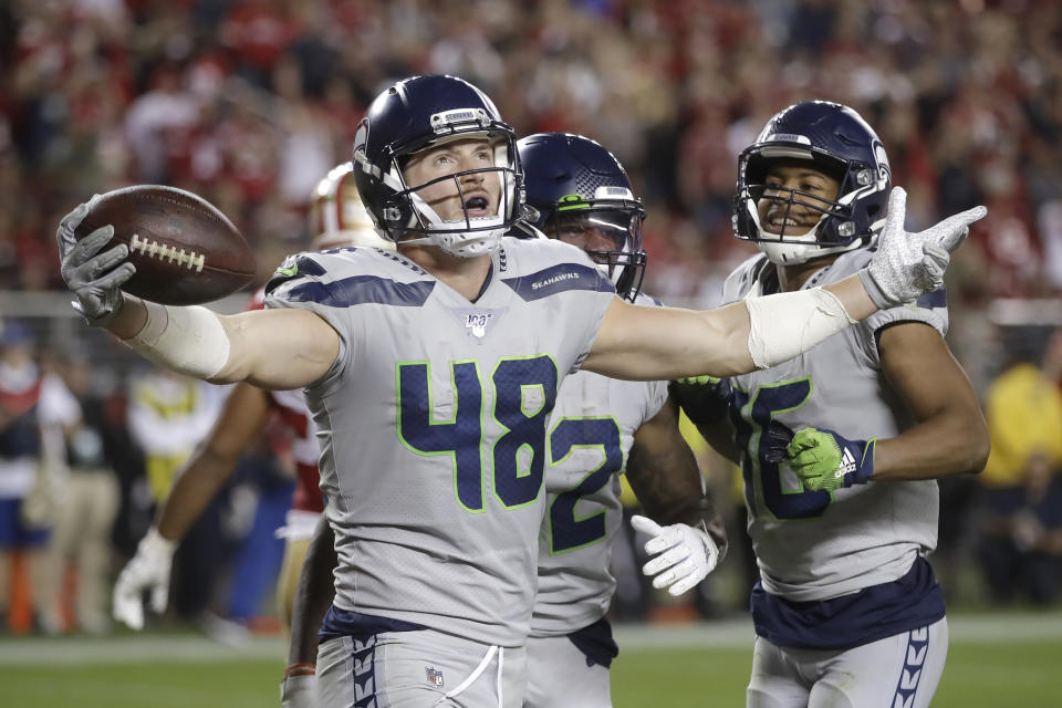 Seattle Seahawks tight end Jacob Hollister (48) celebrates after scoring against the San Francisco 49ers during the second half of an NFL football game in Santa Clara, Calif., Monday, Nov. 11, 2019. (AP Photo/Ben Margot)