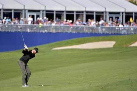 Jan 28, 2017; La Jolla, CA, USA; Patrick Rodgers plays his shot from the 17th fairway during the third round of the Farmers Insurance Open golf tournament at Torrey Pines Municipal Golf Course - South Course. Mandatory Credit: Orlando Ramirez-USA TODAY Sports - RTSXTZT