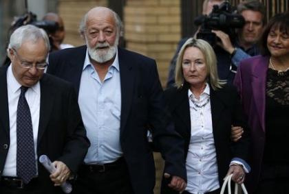 Reeva Steenkamp&#39;s parents, June (2nd R) and Barry Steenkamp (2nd L), arrive for the closing arguments. (REUTERS)