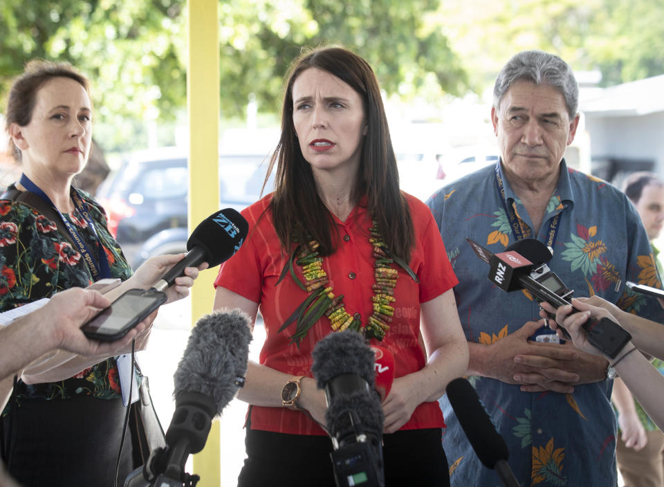 New Zealand's Prime Minister Jacinda Ardern, center, and Foreign Affairs Minister Winston Peters, right, speak to the media during the Pacific Islands Forum in Nauru Wednesday, Sept. 5, 2018. The Pacific leaders meeting are expected Wednesday to sign a security agreement that addresses climate change and crimes such as drug smuggling and illegal fishing that cross borders. (Jason Oxenham/Pool Photo via AP)