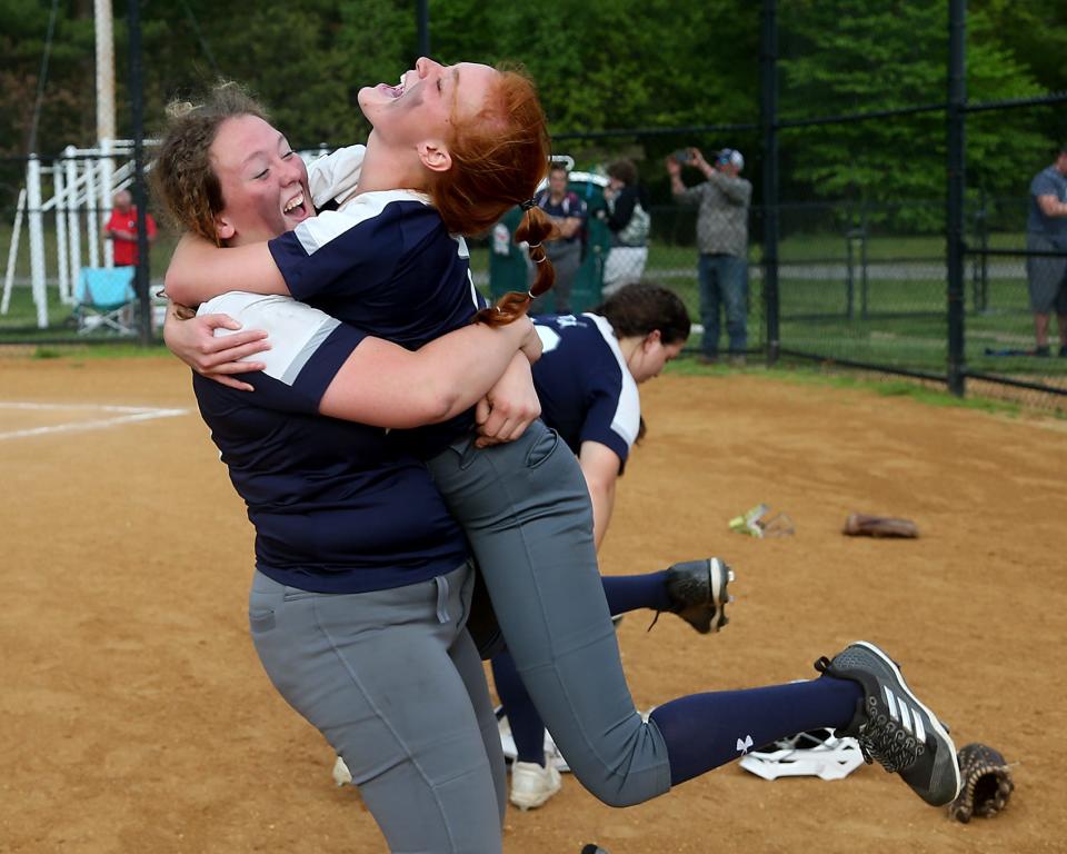 Plymouth North's Maggie Ladd picks up teammate Emily Jenkins while celebrating their 17-5 win over Silver Lake at Silver Lake Regional High School on Friday, May 20, 2022.