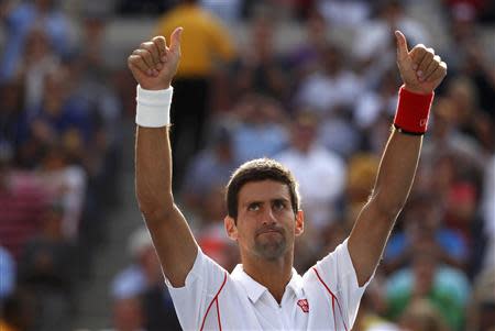 Novak Djokovic of Serbia celebrates after defeating Stanislas Wawrinka of Switzerland during their men's semi-final match at the U.S. Open tennis championships in New York September 7, 2013. REUTERS/Adam Hunger