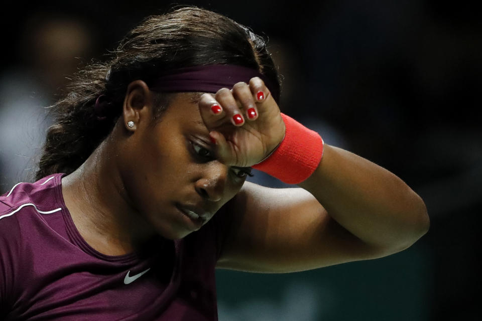 Sloane Stephens of the United States wipes her brows during a women's singles match against Naomi Osaka of Japan at the WTA tennis tournament in Singapore on Monday, Oct. 22, 2018. (AP Photo/Vincent Thian)