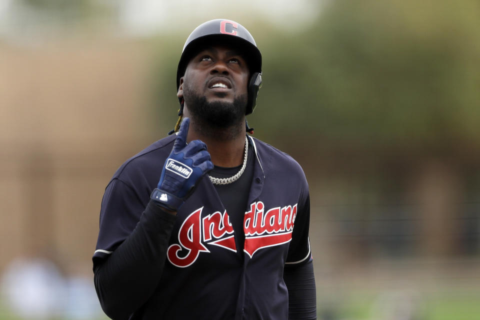 Cleveland Indians' Franmil Reyes points skyward after hitting a home run during the second inning of a spring training baseball game against the Chicago White Sox, Friday, Feb. 28, 2020, in Glendale, Ariz. (AP Photo/Gregory Bull)