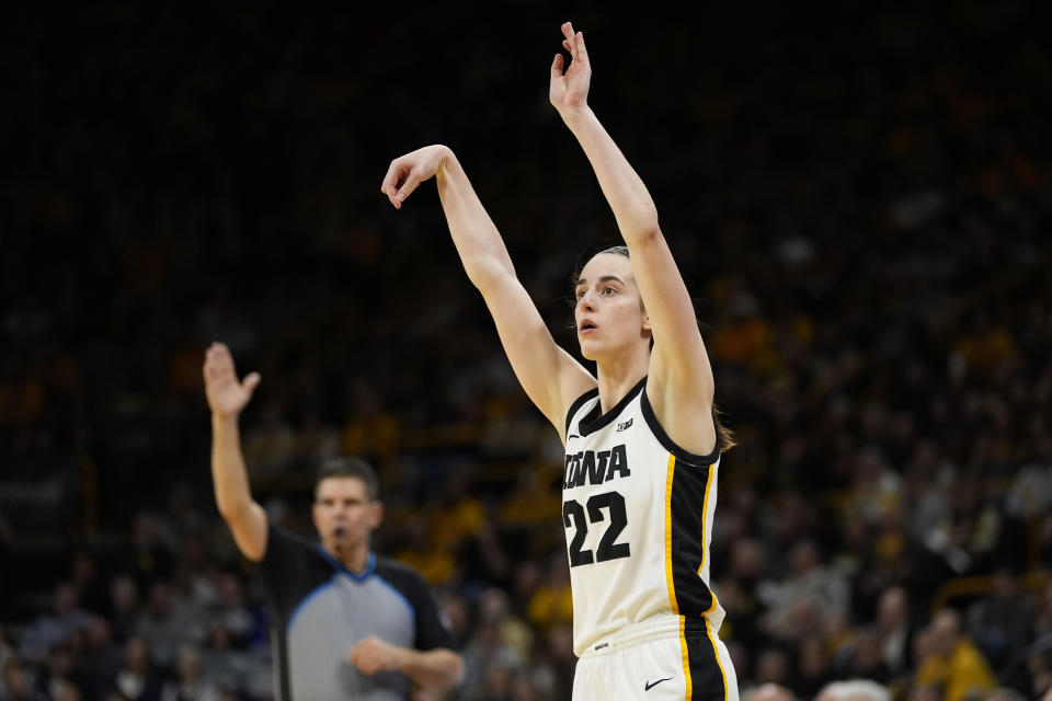 FILE - Iowa guard Caitlin Clark (22) watches her shot during the second half of an NCAA college basketball game against Penn State, Thursday, Feb. 8, 2024, in Iowa City, Iowa. Iowa won 111-93. Iowa's Caitlin Clark will soon be the NCAA's scoring leader. That's fact and, in many minds, enough to put the 22-year-old star high up among the greats of college basketball. (AP Photo/Charlie Neibergall, File)