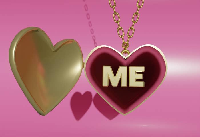 A gold heartshaped locket with that says "ME" on the inside on pink velvet