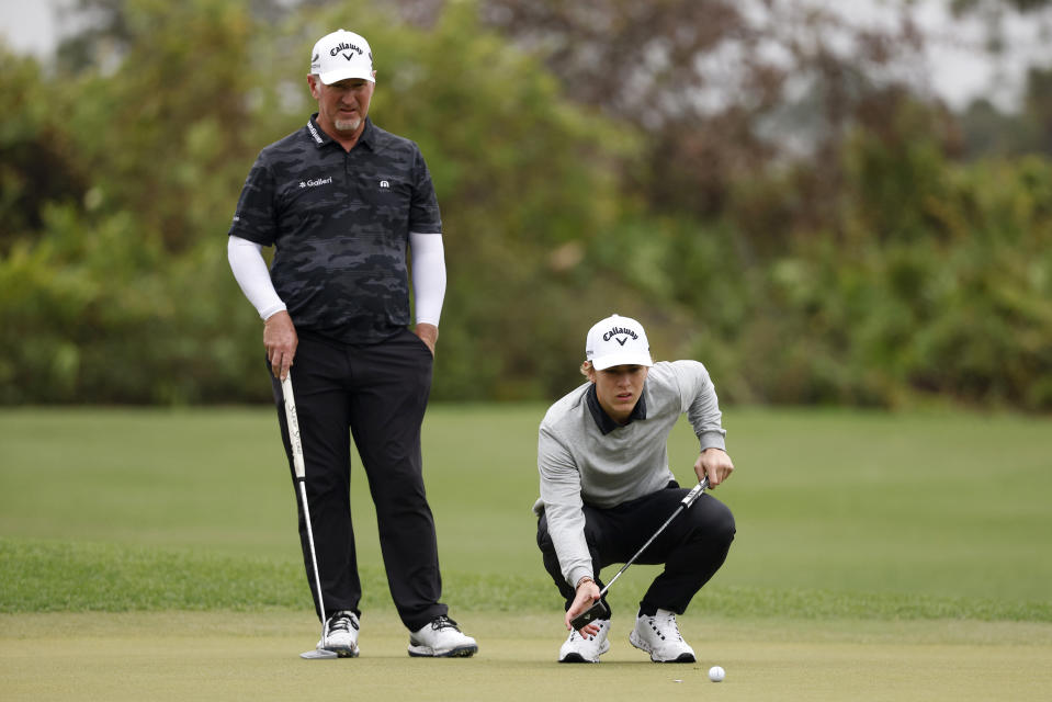 David Duval and son, Brady Duval, line up a putt on the third green during the final round of the PNC Championship at The Ritz-Carlton Golf Club on Dec. 17, 2023 in Orlando. (Photo by Mike Mulholland/Getty Images)