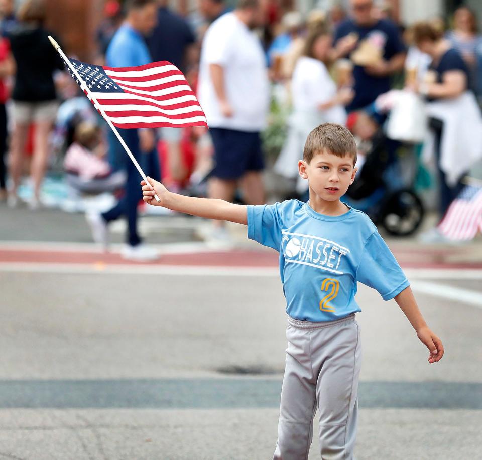 Everett Manley, 7, of Cohasset, has a new flag for the annual July 4th parade in Hingham Square in 2021.