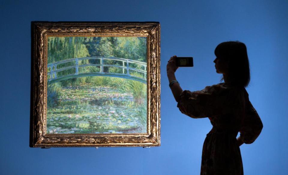 York Press: Dr Beatrice Bertram with Monet's 'The Water-Lily Pond' which will be on display at York Art Gallery from Friday