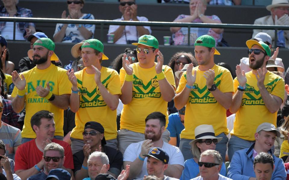 Australian fans watch John Millman in action - Credit: TOBY MELVILLE/REUTERS