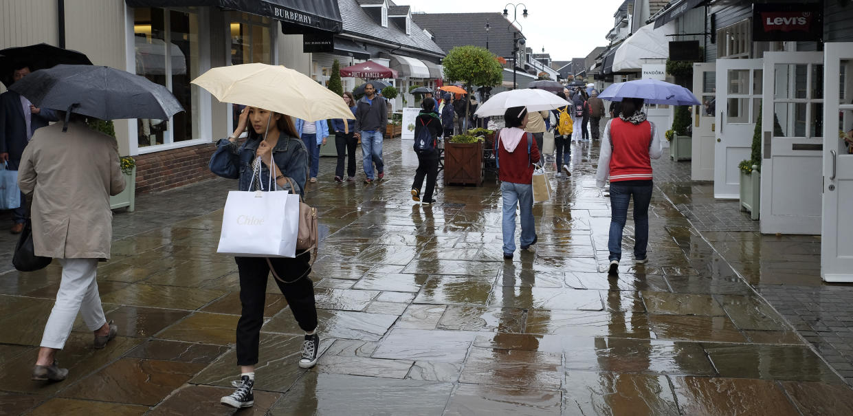 Shoppers at Bicester Village designer outlet centre, in Bicester, England