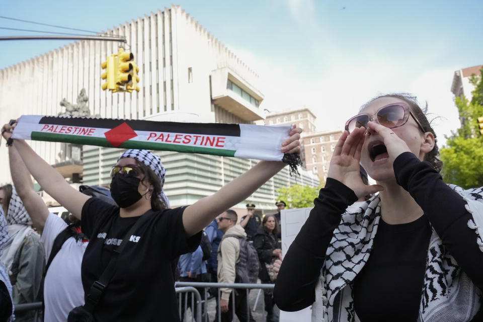 FILE - Protesters demonstrate against the war in Gaza outside the entrance to the campus of Columbia University, Tuesday, April 30, 2024, in New York. (AP Photo/Mary Altaffer, File)