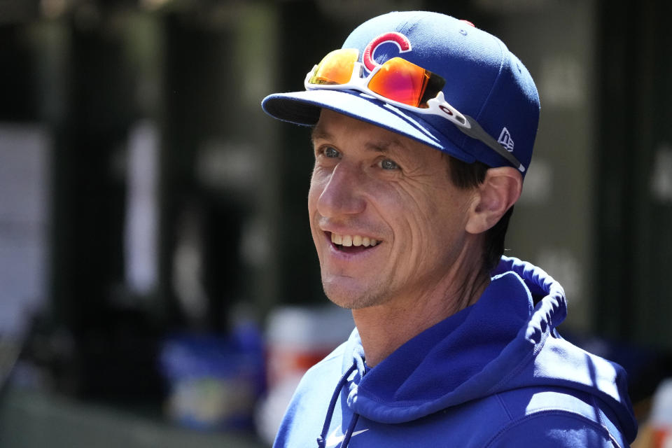 Chicago Cubs manager Craig Counsell smiles as he watches players warm up before a baseball game against the Milwaukee Brewers in Chicago, Sunday, May 5, 2024. (AP Photo/Nam Y. Huh)