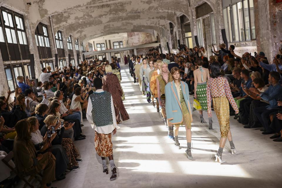 Models wear creations for the Dries Van Noten Spring/Summer 2024 womenswear fashion collection presented Wednesday, Sept. 27, 2023 in Paris. (AP Photo/Vianney Le Caer)