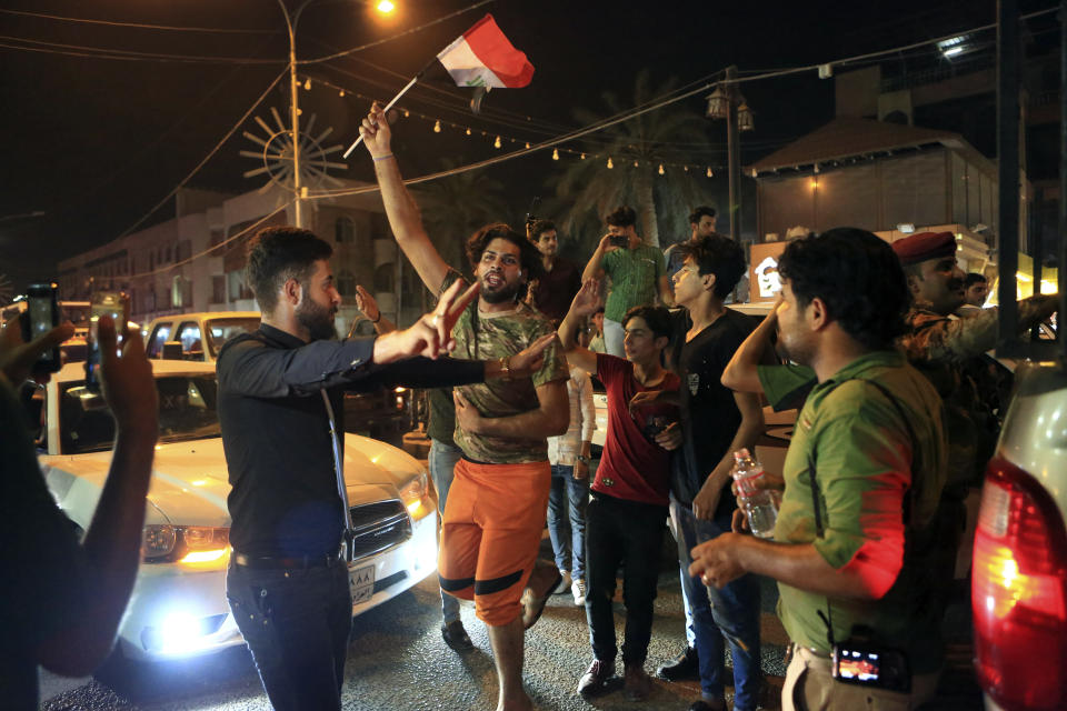 Iraqi security and civilians celebrate while holding national flags, in Basra, 340 miles (550 kilometers) southeast of Baghdad, Iraq, Monday, July 10, 2017. Iraqi Prime Minister Haider al-Abadi declared victory against the Islamic State group in Mosul Monday evening, after nearly nine months of largely grueling urban combat. Amid the death and destruction war leaves in its wake, there are powerful dynamics and narratives: domination, besieged populations, occupation and their counterparts, resistance, freedom and liberation. Vast swaths of Western and Eastern Europe and the Soviet Union knew this well at various points of the 20th century. (AP Photo/Nabil al-Jurani, File)