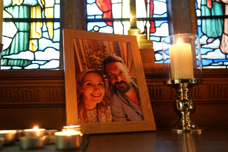 Candles lit around a photo of Nicola Bulley and her partner Paul Ansell on an altar at St Michael's Church. (PA)