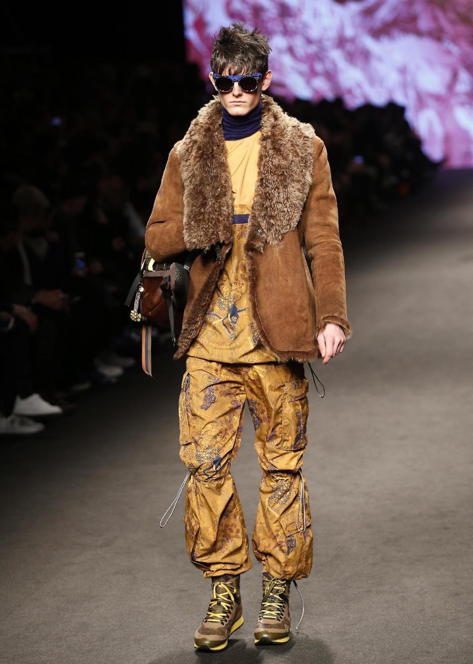 A model wears a creation for Etro men's Fall-Winter 2017-2018 collection, part of the Milan Fashion Week, unveiled in Milan, Italy, Monday, Jan. 16, 2017. (AP Photo/Antonio Calanni)