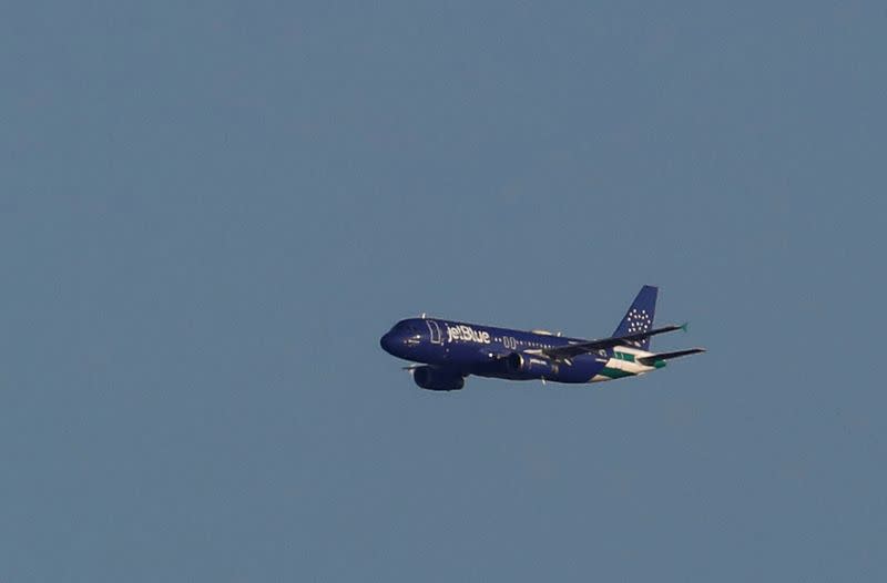 FILE PHOTO: A JetBlue A320 aircraft conducts a flyover salute of New York City to honor frontline healthcare workers during the outbreak of the coronavirus disease (COVID-19) as seen from Weehawken